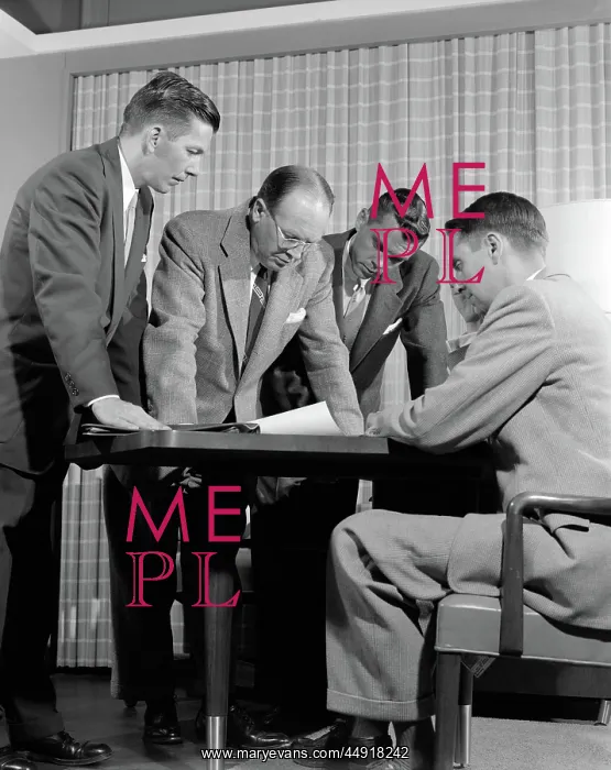 : Group of men businessmen looking at plan on desktop : Group of men businessmen looking at plan on desktop