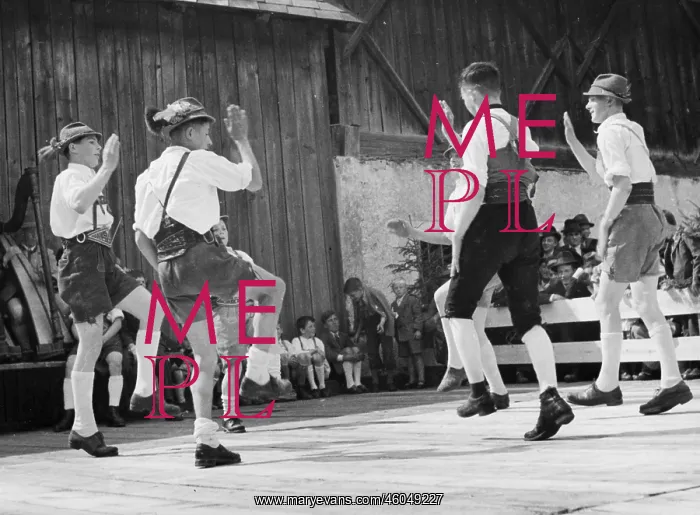 : Group of men dancing a Bavarian folk dance : Group of men dancing a Bavarian folk dance
