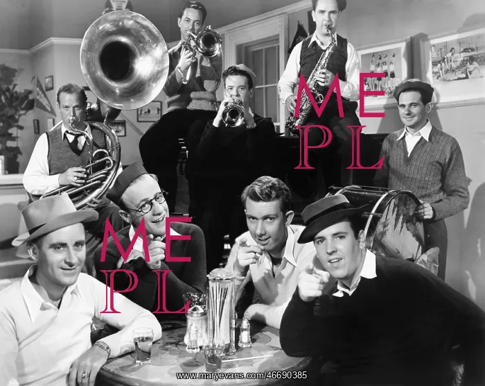 : Group of men sitting in a diner with musicians behind them : Group of men sitting in a diner with musicians behind them