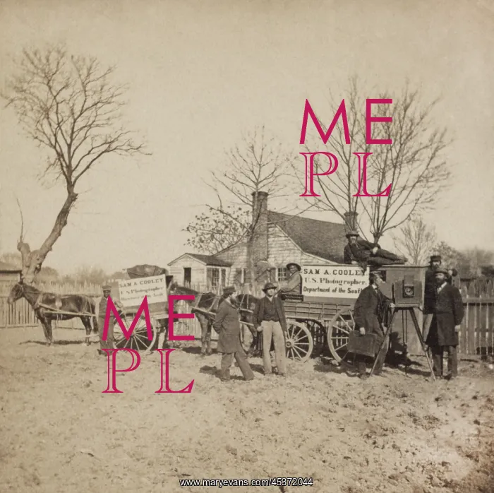 : A group of men stand next to wagons labeled : A group of men stand next to wagons labeled