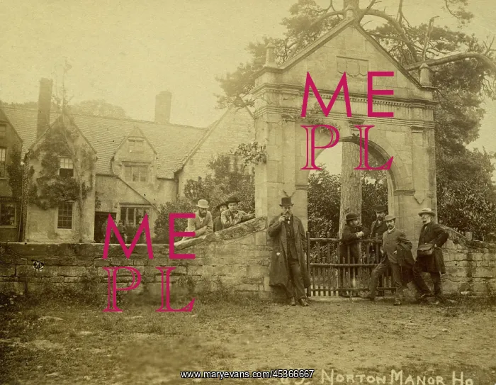 : A group of men standing in front of the stone : A group of men standing in front of the stone