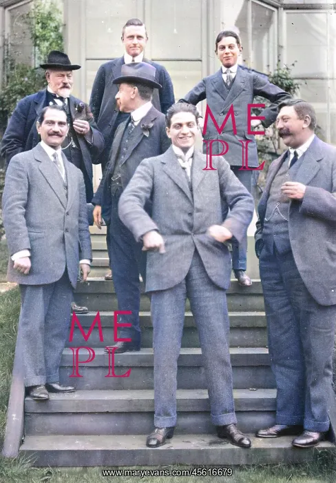 : Group of men on steps of house : Group of men on steps of house