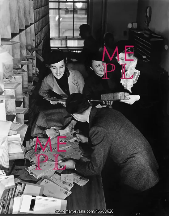  : Group of people going through a pile of mail