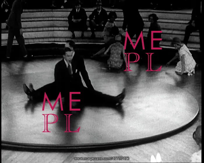 : A Group of People Sitting on a Large Rotating : A Group of People Sitting on a Large Rotating