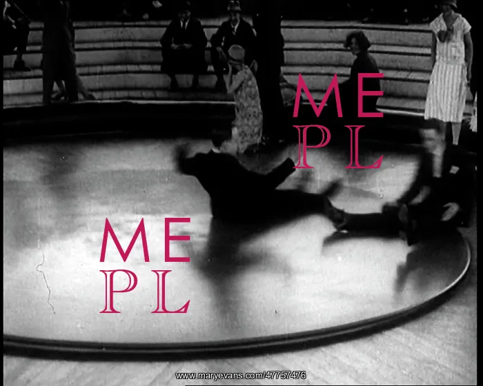 : A Group of People Sitting on a Large Rotating : A Group of People Sitting on a Large Rotating