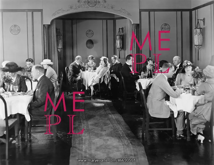 : Group of people sitting in a restaurant having dinner : Group of people sitting in a restaurant having dinner