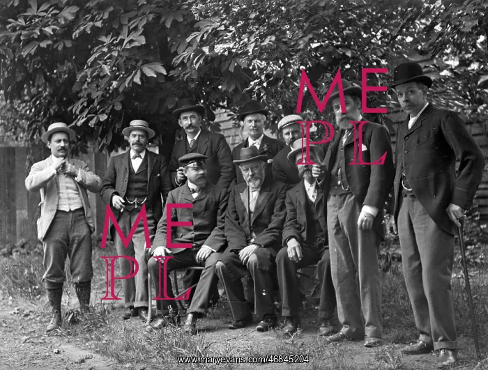 : Group photo of men in a garden : Group photo of men in a garden