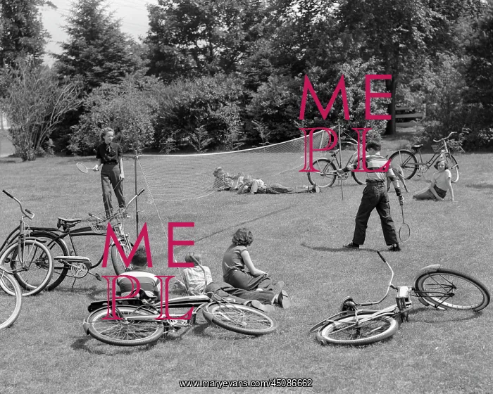 : Group of Teens Playing Badminton Outdoors Lying : Group of Teens Playing Badminton Outdoors Lying