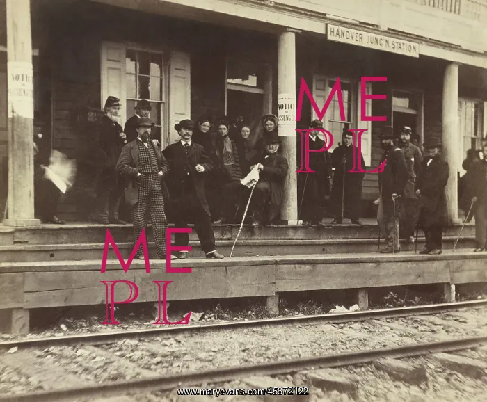 : A group of well-dressed men and women standing : A group of well-dressed men and women standing