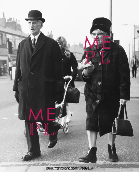 : Grumpy elderly couple out shopping : Grumpy elderly couple out shopping