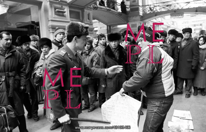 : GUM, 1992. Moscow. Russia. Militsioner detaining a picketer at the GUM : GUM, 1992. Moscow. Russia. Militsioner detaining a picketer at the GUM