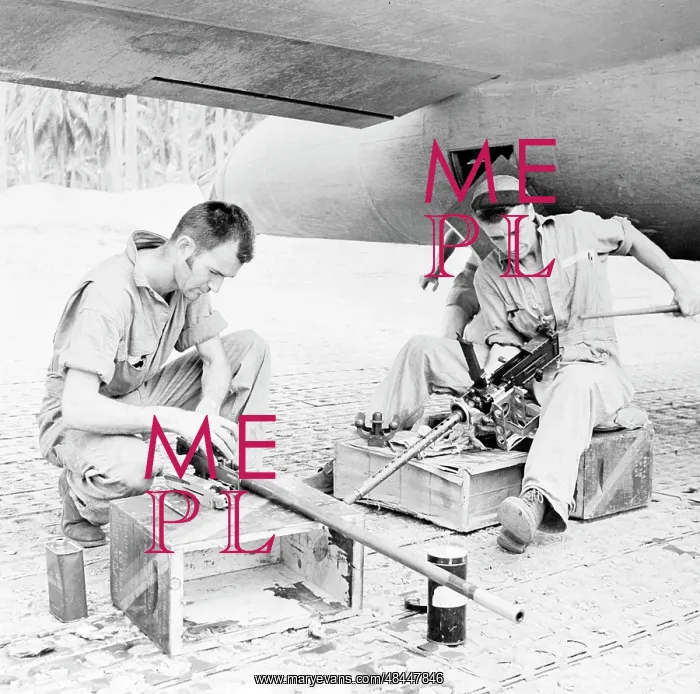 : Gunners carefully clean their.50 caliber : Gunners carefully clean their.50 caliber