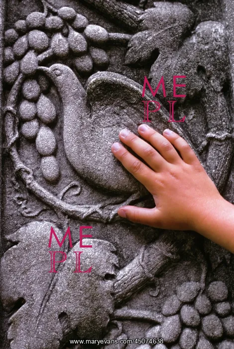 : Hand of Child Touching Dove of Peace Carved on : Hand of Child Touching Dove of Peace Carved on