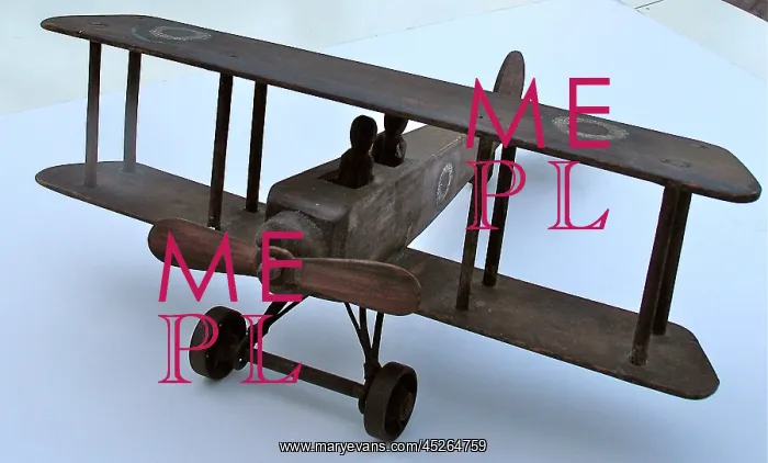 : A hand-made wooden model of a WWI biplane : A hand-made wooden model of a WWI biplane