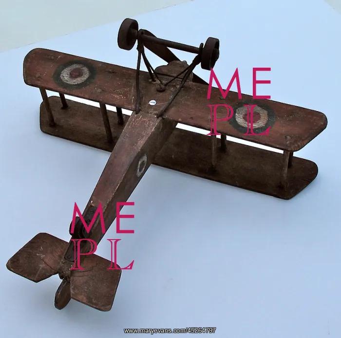 : A hand-made wooden model of a WWI biplane : A hand-made wooden model of a WWI biplane