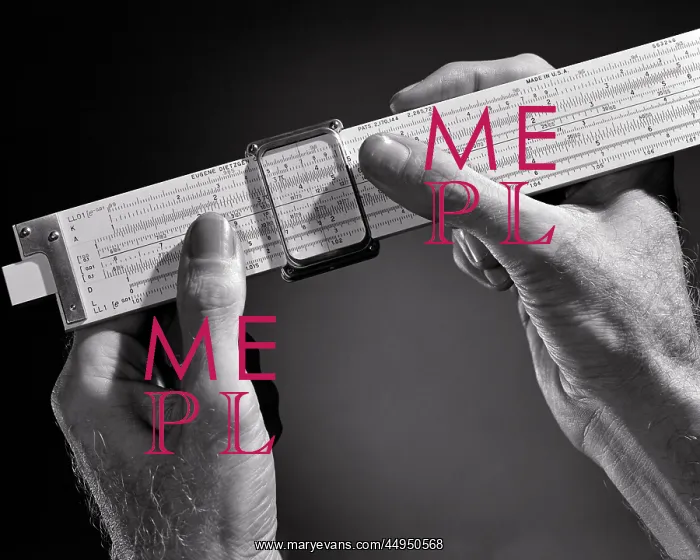: Hands Holding Slide Rule a Mechanical Analog Computer : Hands Holding Slide Rule a Mechanical Analog Computer