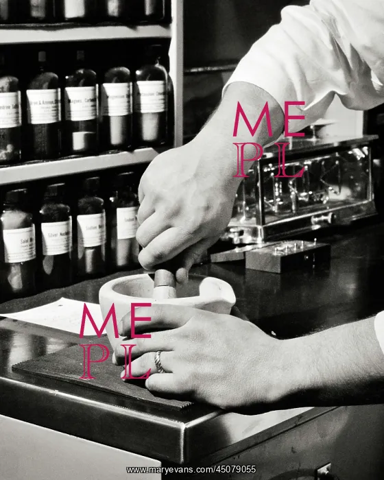  : Hands of Male Chemist Using a Mortar and Pestle