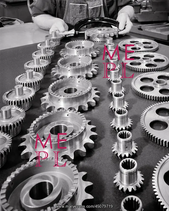 : Hands Performing Quality Check on 3 Assembled Gear Pieces : Hands Performing Quality Check on 3 Assembled Gear Pieces