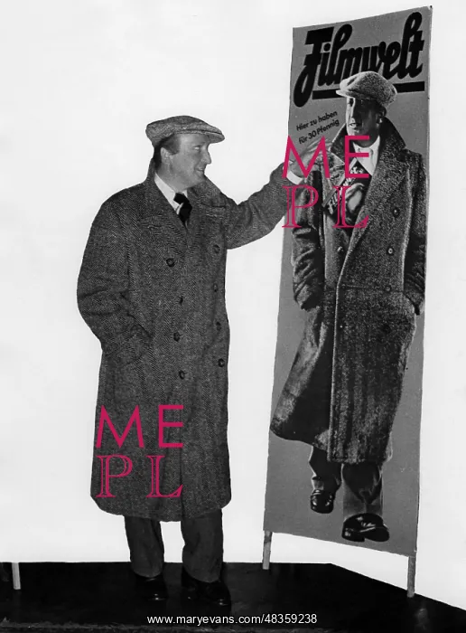 : Hans Albers observing an advertising poster, 1934 : Hans Albers observing an advertising poster, 1934