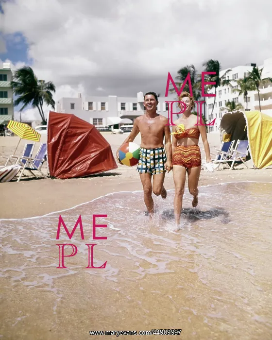 : Happy Couple Looking at Camera Running on Tropical Beach : Happy Couple Looking at Camera Running on Tropical Beach