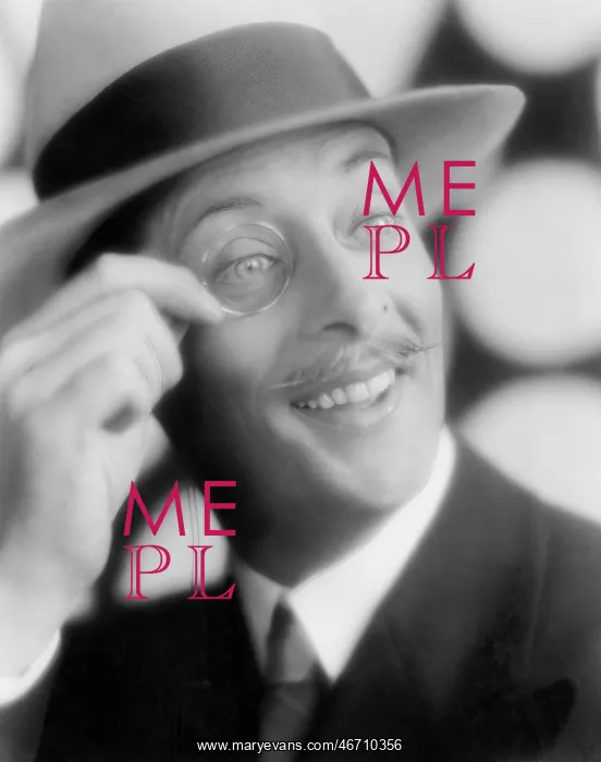 : Happy looking man with a monocle in his hand : Happy looking man with a monocle in his hand