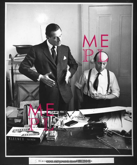 : Hardy Amies discussing designs with tailor : Hardy Amies discussing designs with tailor
