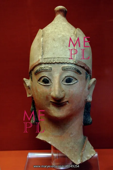 : Head from a statue of a warrior with conical helmet. 625-600 : Head from a statue of a warrior with conical helmet. 625-600