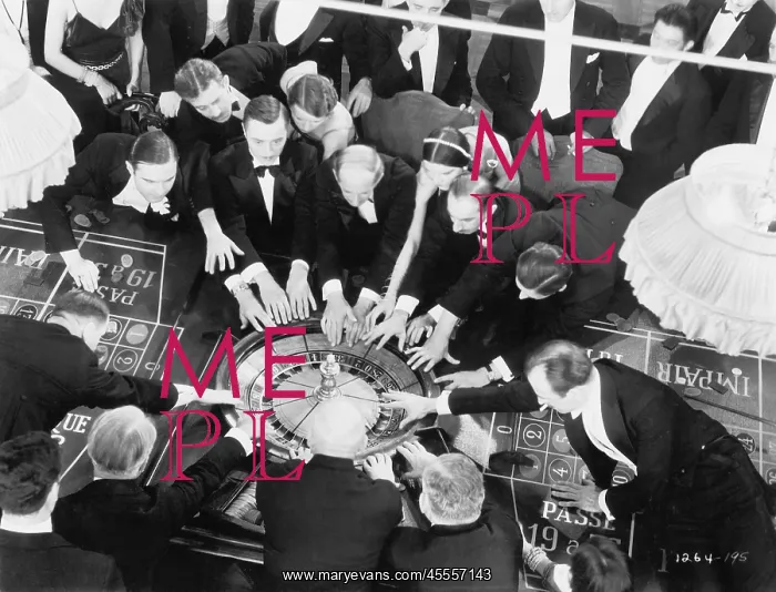 : High angle of a group of people playing roulette : High angle of a group of people playing roulette