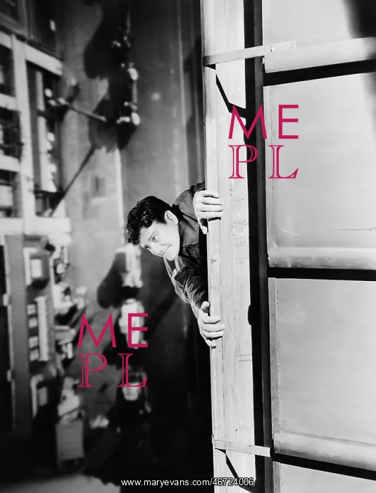 : High angle view of a man hanging from a rooftop : High angle view of a man hanging from a rooftop