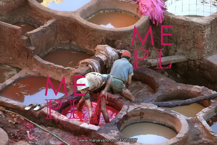 : Fez. High angle view of reflections in the dyeing pits where men are working : Fez. High angle view of reflections in the dyeing pits where men are working