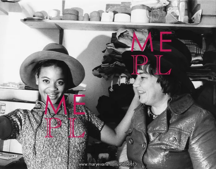 : A high school student tries on one of Bella Abzug's : A high school student tries on one of Bella Abzug's