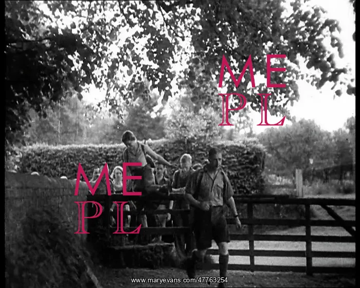 : Hikers Climbing over a Gate : Hikers Climbing over a Gate