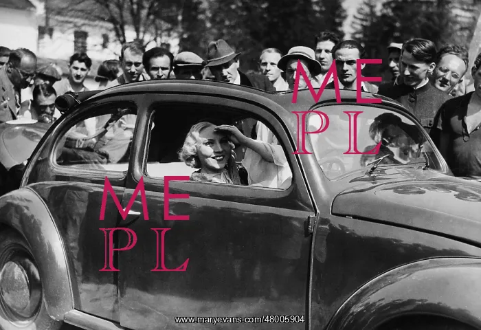 : Hilde Koerber in a VW Beetle in Munich, around 1939 : Hilde Koerber in a VW Beetle in Munich, around 1939