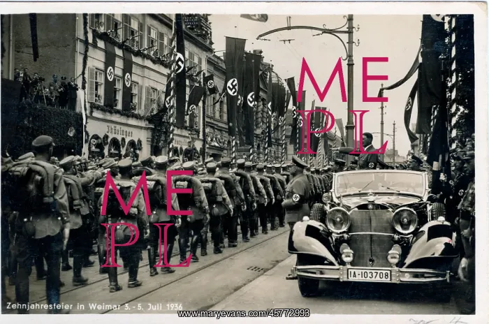 : Hitler saluting from his Mercedes to a marching column : Hitler saluting from his Mercedes to a marching column