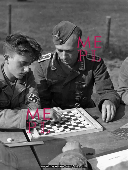 : Hitler Youth member and his instructor playing chess, 16.0 : Hitler Youth member and his instructor playing chess, 16.0