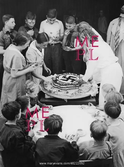 : Hitler's birthday cake is being shared, 1934 : Hitler's birthday cake is being shared, 1934