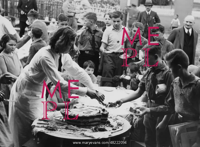 : Hitler's birthday cake is being shared, 1934 : Hitler's birthday cake is being shared, 1934