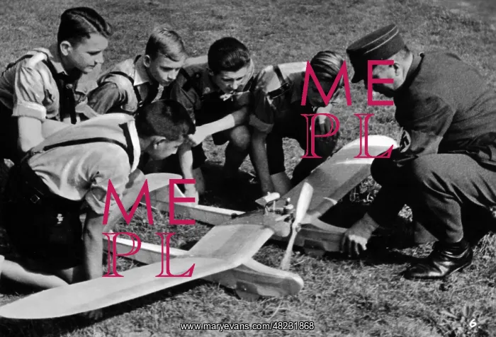 : HJ members with model airplane, 1941 : HJ members with model airplane, 1941