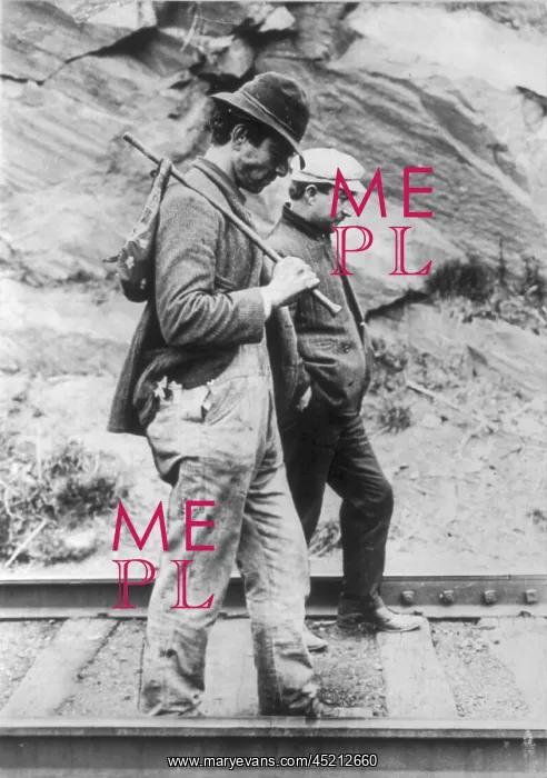 : Two hobos walking along railroad tracks, ? : Two hobos walking along railroad tracks, ?