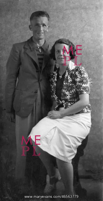 : Holiday couple pose for their photograph : Holiday couple pose for their photograph