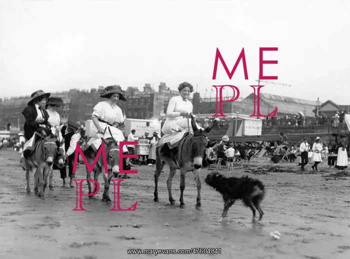 : Holidaymakers riding donkeys on a beach : Holidaymakers riding donkeys on a beach