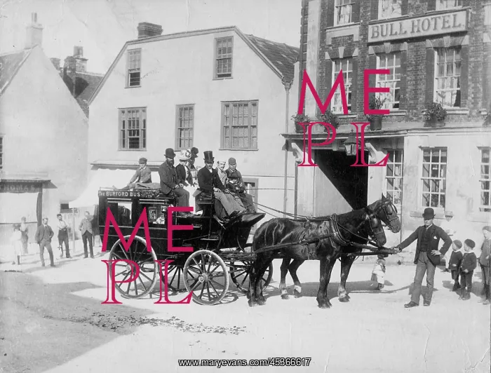 : A horse drawn bus and passengers waiting in the : A horse drawn bus and passengers waiting in the