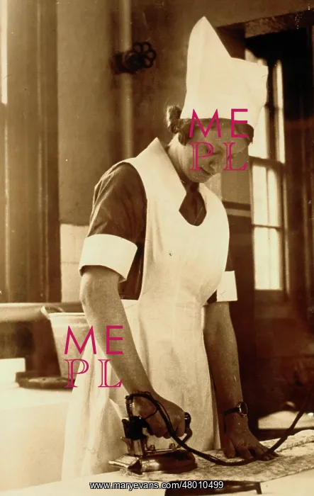 : Hospital nurse doing some ironing : Hospital nurse doing some ironing