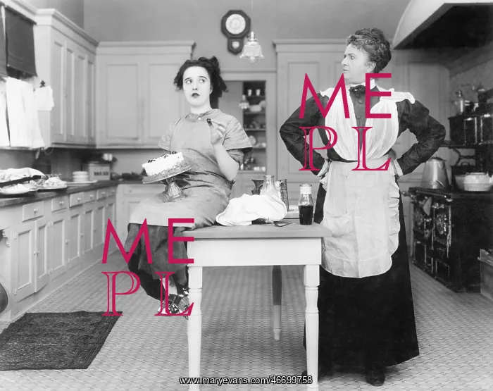 : Housekeeper in the kitchen glaring at a young woman : Housekeeper in the kitchen glaring at a young woman