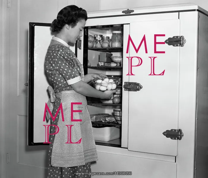 : Housewife in apron taking eggs out of bowl from : Housewife in apron taking eggs out of bowl from