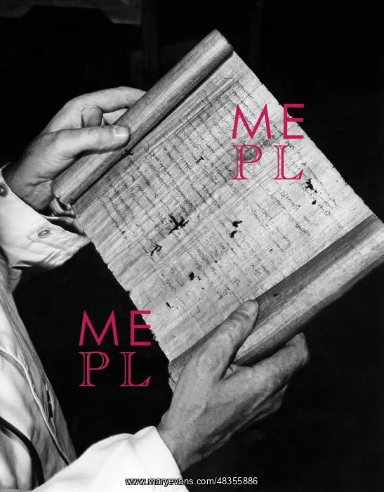 : Hugo Ibscher holds a papyrus document in roll form, 1934 : Hugo Ibscher holds a papyrus document in roll form, 1934