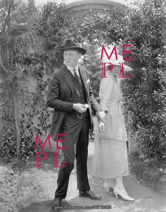 : Husband stopping his wife to continue walking through : Husband stopping his wife to continue walking through