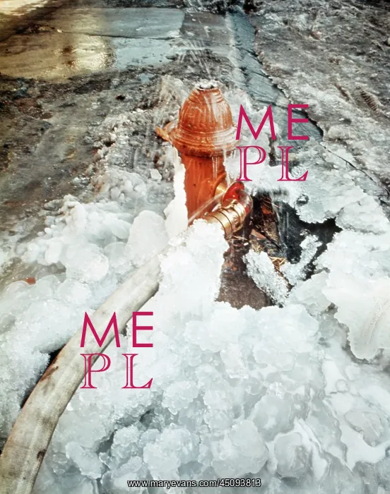 : Ice Covered Fire Hydrant and Connected Hose During : Ice Covered Fire Hydrant and Connected Hose During