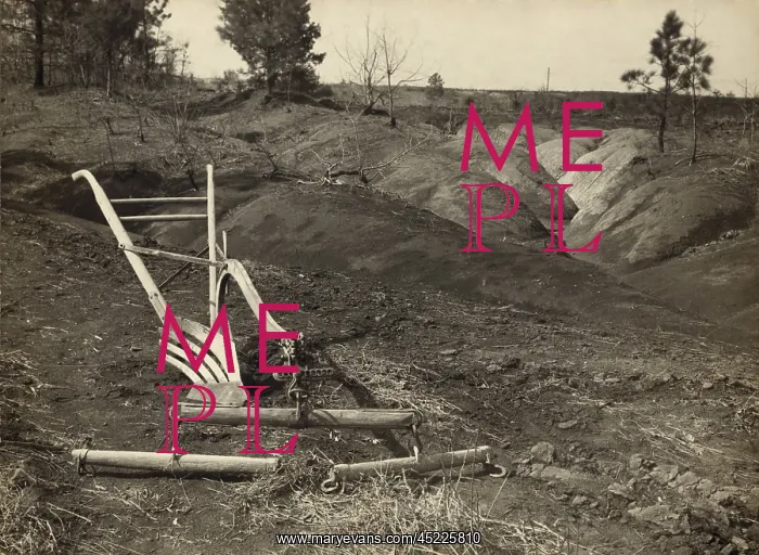 : An idle plow on farm land adjacent to eroded ? : An idle plow on farm land adjacent to eroded ?