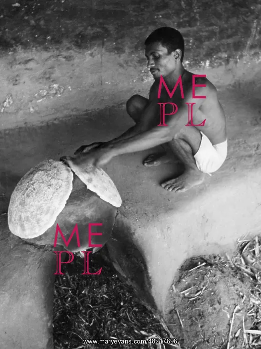 : Indian mahout baking a flatbread : Indian mahout baking a flatbread